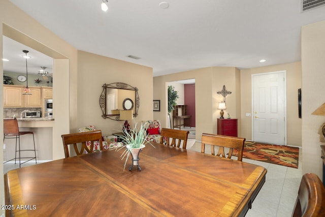 dining room with light tile patterned flooring