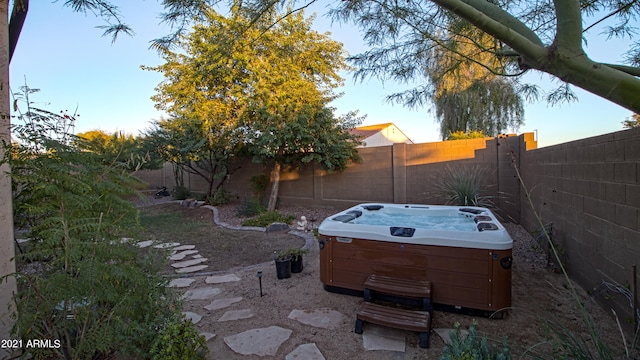 view of yard with a hot tub