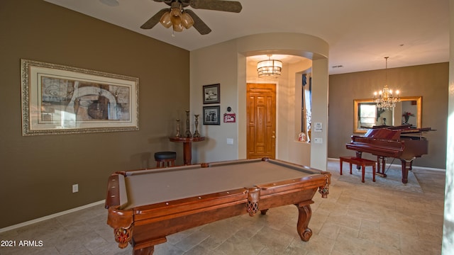 rec room featuring billiards and ceiling fan with notable chandelier