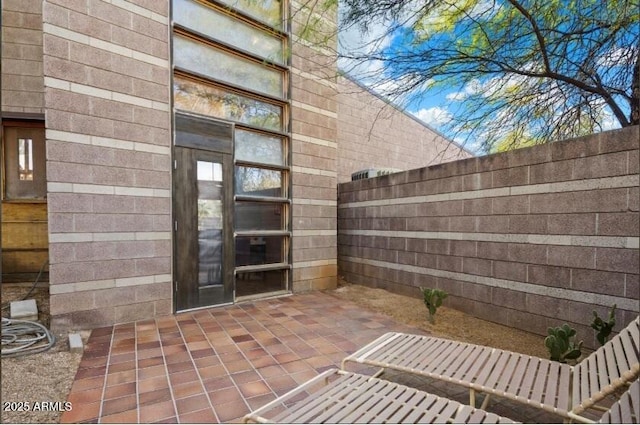 25232 N Horseshoe Trl, Scottsdale, AZ 85255 - view of exterior entry featuring a patio
