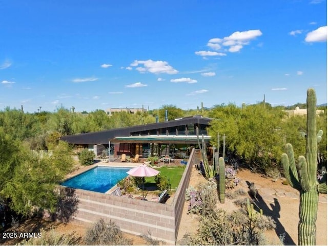 25232 N Horseshoe Trl, Scottsdale, AZ 85255 - rear view of house with an outdoor pool and a patio area