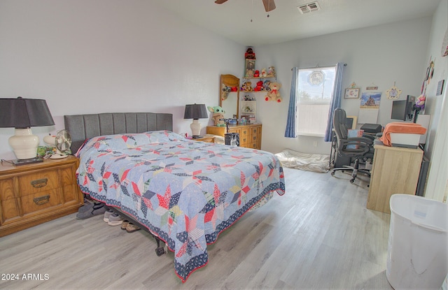 bedroom featuring ceiling fan and light hardwood / wood-style flooring