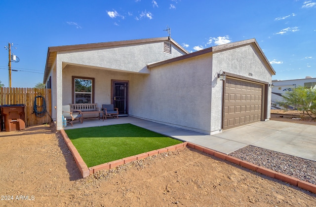 view of front facade featuring a front yard and a garage