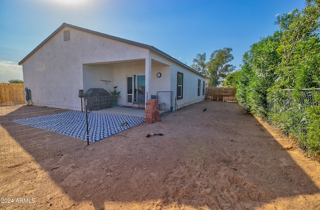 rear view of house with a patio