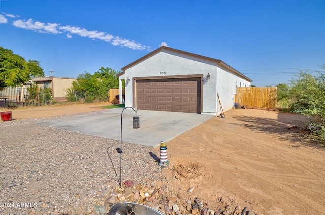 view of side of home featuring a garage