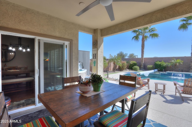 view of patio / terrace with a fenced backyard, a ceiling fan, outdoor dining area, and a fenced in pool