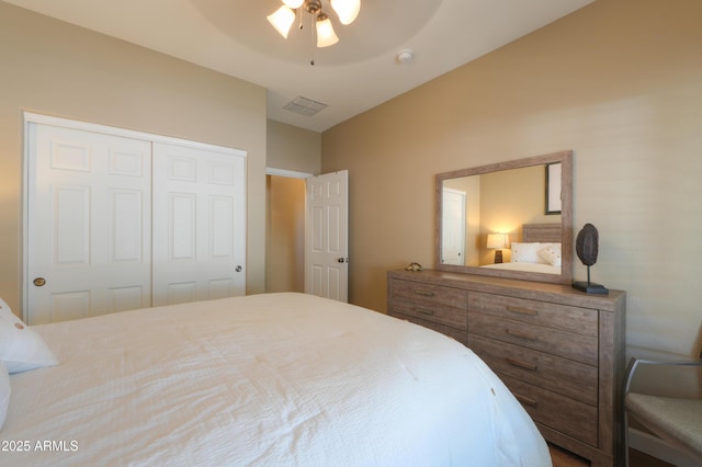 bedroom featuring a closet, visible vents, and ceiling fan