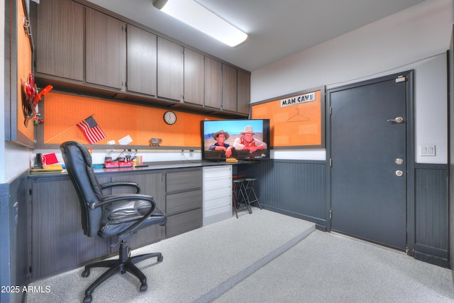 home office with a wainscoted wall