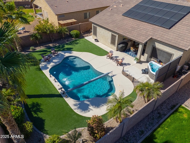 view of pool with a patio, a lawn, a fenced backyard, and a fenced in pool