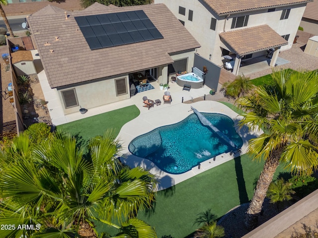 pool featuring a fenced backyard, an outdoor hot tub, and a patio