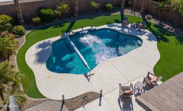 view of pool with a patio area, a fenced backyard, a fenced in pool, and a yard