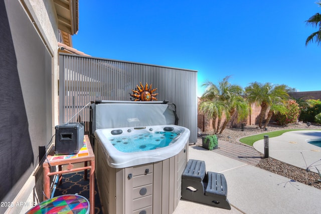 view of patio / terrace featuring a hot tub