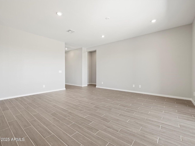 17561 W Pierson St, Goodyear, AZ 85395 - empty room featuring light wood-style flooring, baseboards, and recessed lighting