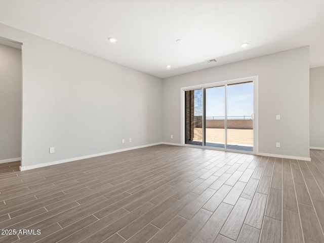 17561 W Pierson St, Goodyear, AZ 85395 - empty room with wood finished floors, baseboards, and recessed lighting
