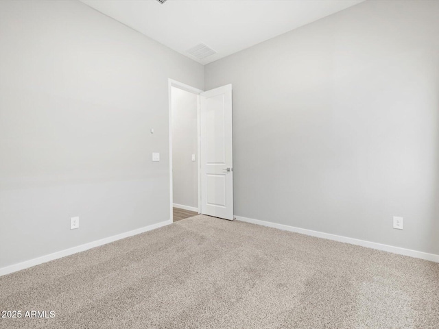 17561 W Pierson St, Goodyear, AZ 85395 - empty room with light colored carpet and baseboards