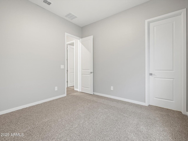 17561 W Pierson St, Goodyear, AZ 85395 - unfurnished bedroom featuring light colored carpet and baseboards