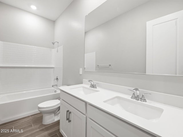 17561 W Pierson St, Goodyear, AZ 85395 - full bathroom featuring toilet, double vanity, wood finished floors, tub / shower combination, and recessed lighting
