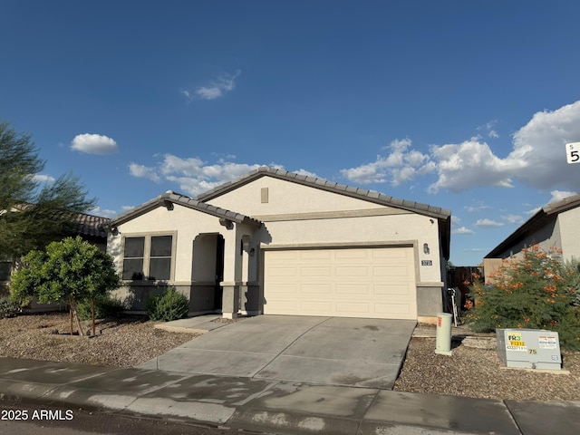 3715 S 57th Ln, Phoenix, AZ 85043 - ranch-style home featuring stucco siding, a garage, driveway, and a tiled roof