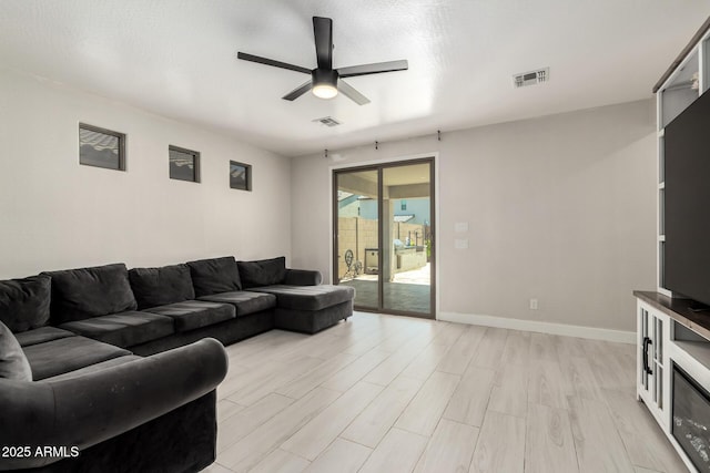 3715 S 57th Ln, Phoenix, AZ 85043 - living area with ceiling fan and light wood-style floors