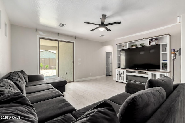 3715 S 57th Ln, Phoenix, AZ 85043 - living area featuring a ceiling fan and baseboards