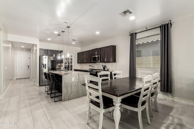 3715 S 57th Ln, Phoenix, AZ 85043 - dining space featuring recessed lighting and baseboards