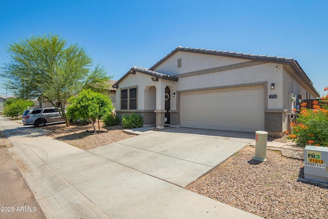 3715 S 57th Ln, Phoenix, AZ 85043 - mediterranean / spanish home with stucco siding, a garage, driveway, and a tiled roof