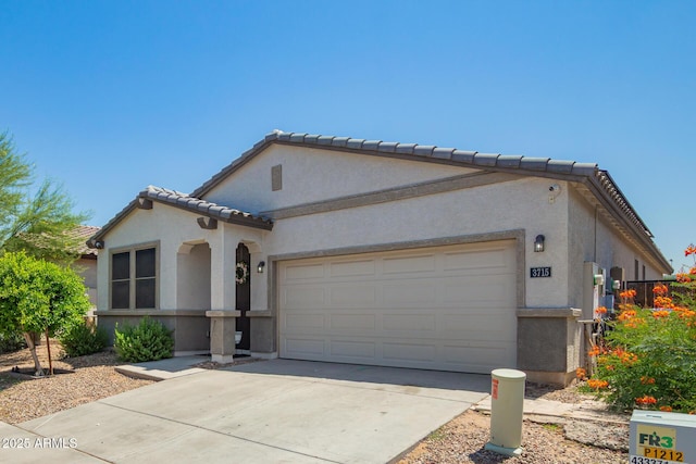 3715 S 57th Ln, Phoenix, AZ 85043 - mediterranean / spanish house with stucco siding, a tiled roof, a garage, and driveway