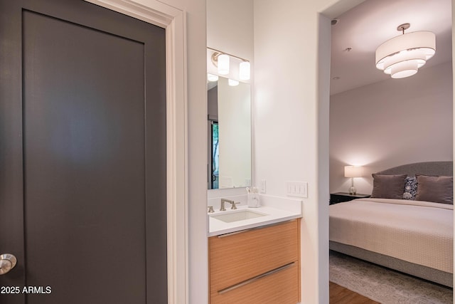 bathroom with vanity and hardwood / wood-style floors