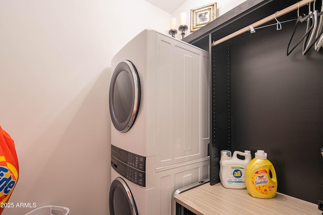 laundry area with stacked washer / drying machine