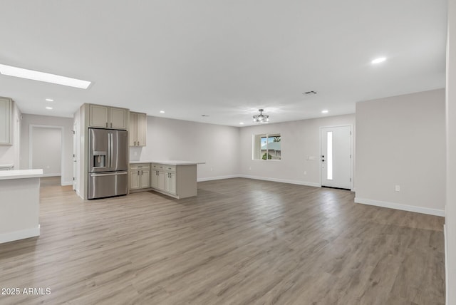 unfurnished living room featuring light hardwood / wood-style floors