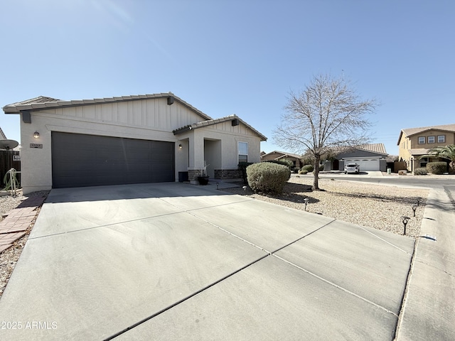 view of front of property featuring driveway and an attached garage