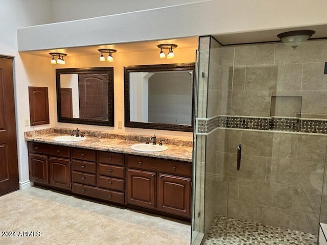 bathroom with vanity and an enclosed shower