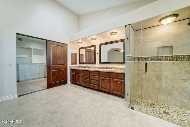 bathroom with vanity, tile patterned floors, and a shower with shower door