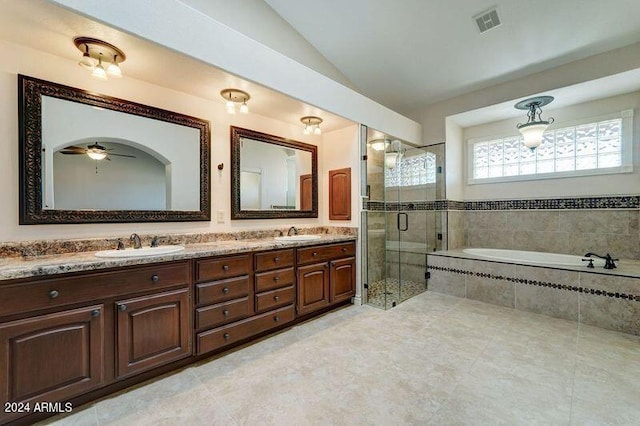 bathroom with vanity, lofted ceiling, plus walk in shower, and ceiling fan