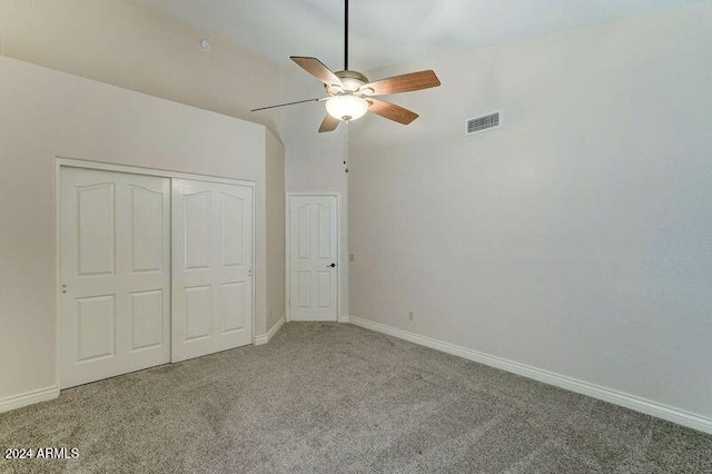 unfurnished bedroom with a closet, carpet floors, and ceiling fan