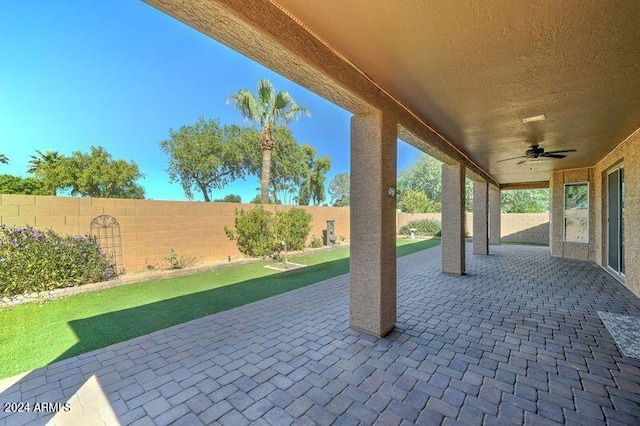 view of patio featuring ceiling fan