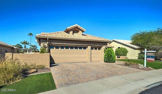 view of front of home with a garage