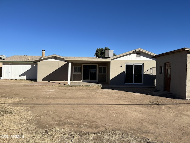 back of house featuring a patio and central air condition unit