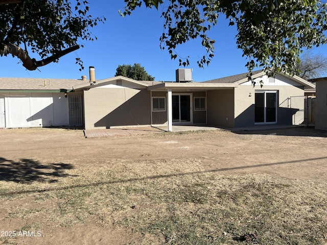 back of house featuring a patio and cooling unit