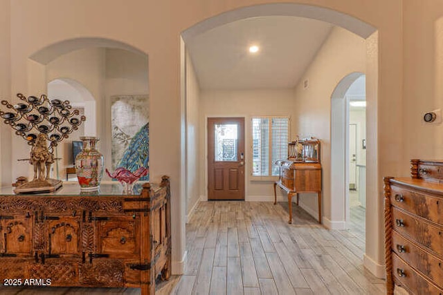 foyer entrance with light hardwood / wood-style flooring