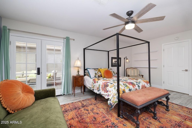 bedroom featuring light wood-type flooring, ceiling fan, and french doors