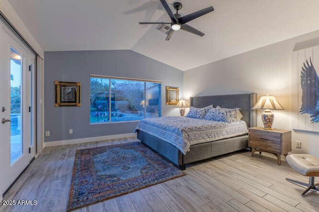 bedroom featuring hardwood / wood-style flooring, ceiling fan, lofted ceiling, and access to outside