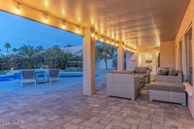 patio terrace at dusk with an outdoor living space