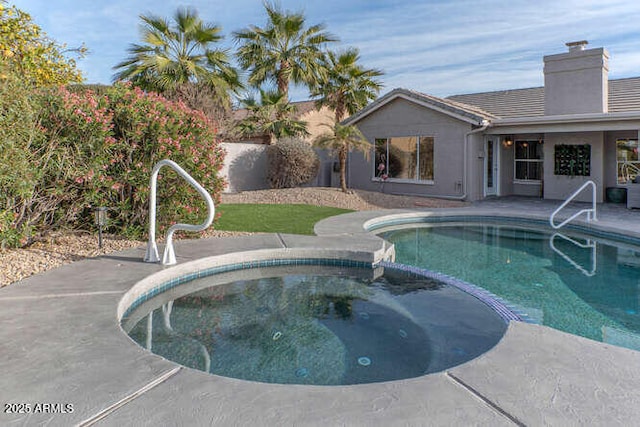 view of pool featuring a patio