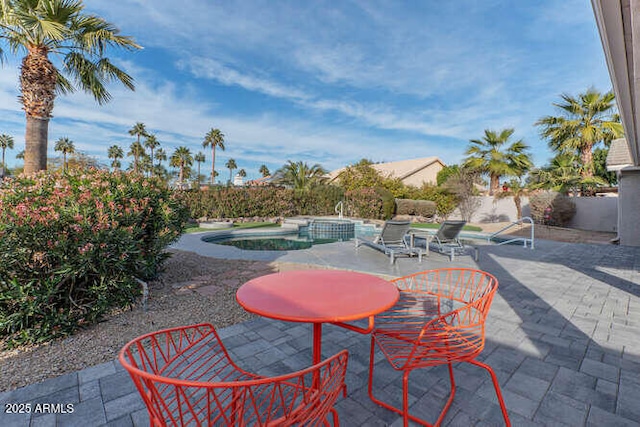 view of patio with a fenced in pool