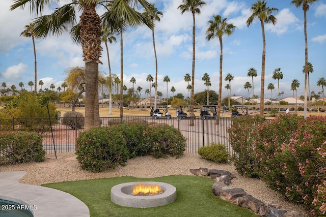 view of property's community with an outdoor fire pit