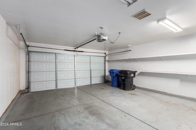 garage featuring a garage door opener