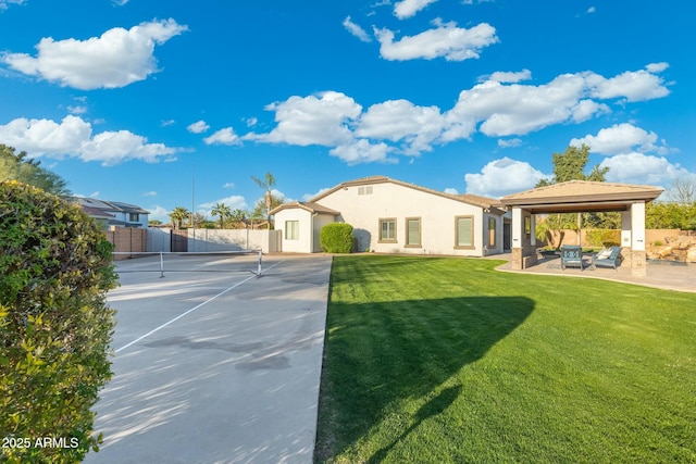 exterior space with a gazebo, a lawn, a patio, and fence