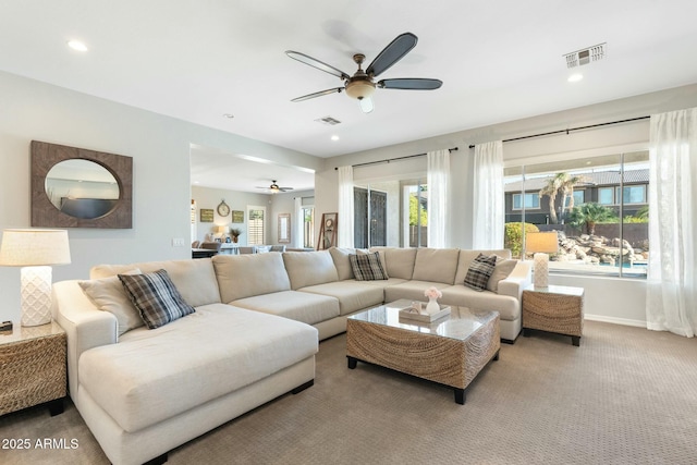 living area with recessed lighting, visible vents, carpet floors, and ceiling fan