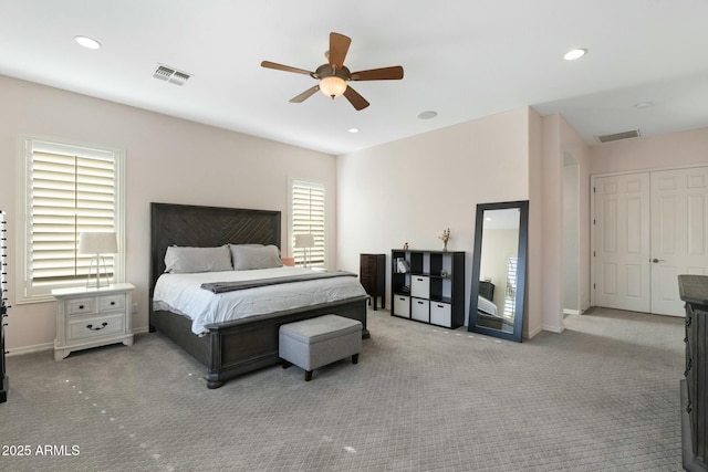 carpeted bedroom with recessed lighting, visible vents, baseboards, and a ceiling fan